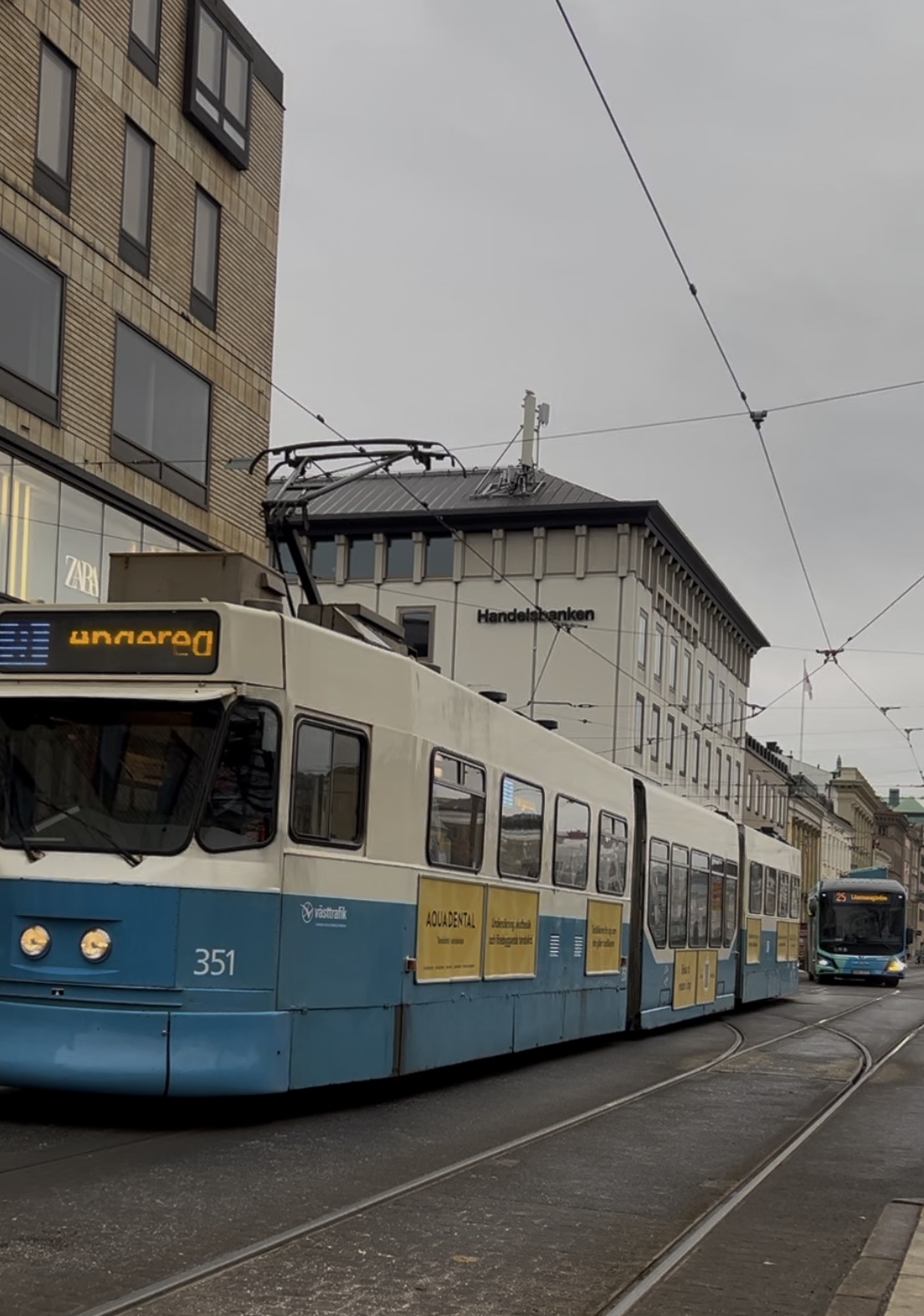 Tram passing through the city on a grey winter day